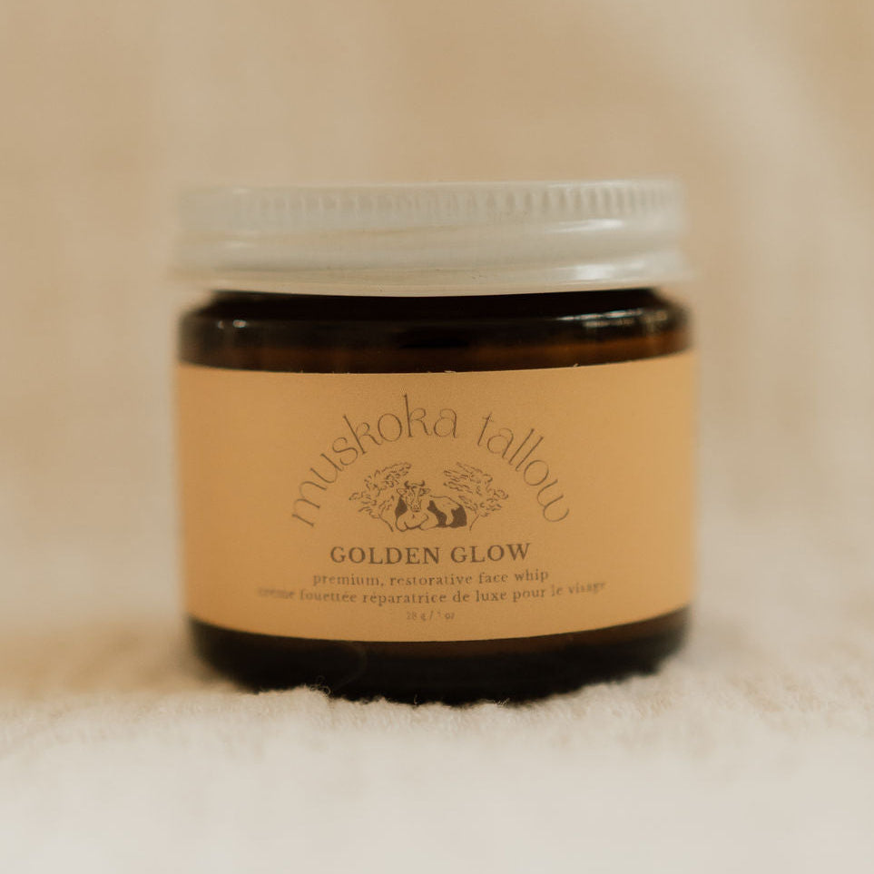 Jar of Muskoka Tallow Golden Glow balm on a beige background