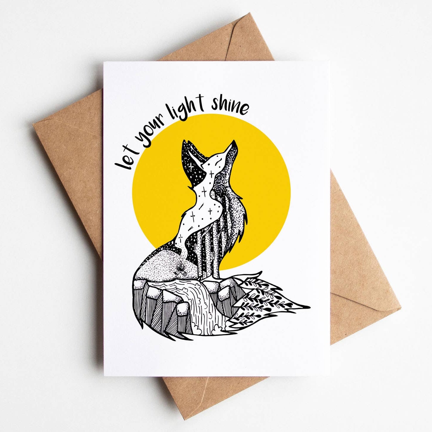 Greeting card with fox illustration and 'let your light shine' text on a white background