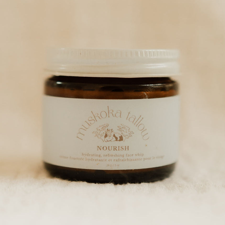 Jar of Muskoka tallow face whip on a beige background